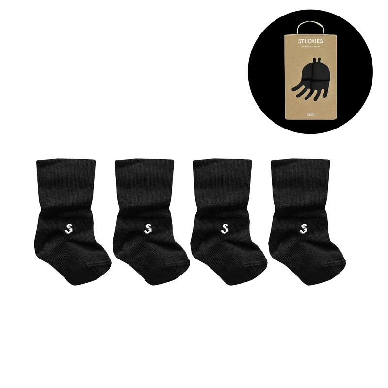 STUCKIES Neugeborenensocken mit nahtloser Zehenpartie und rutschfestem Verschluss – 4er-Pack – Schwarz